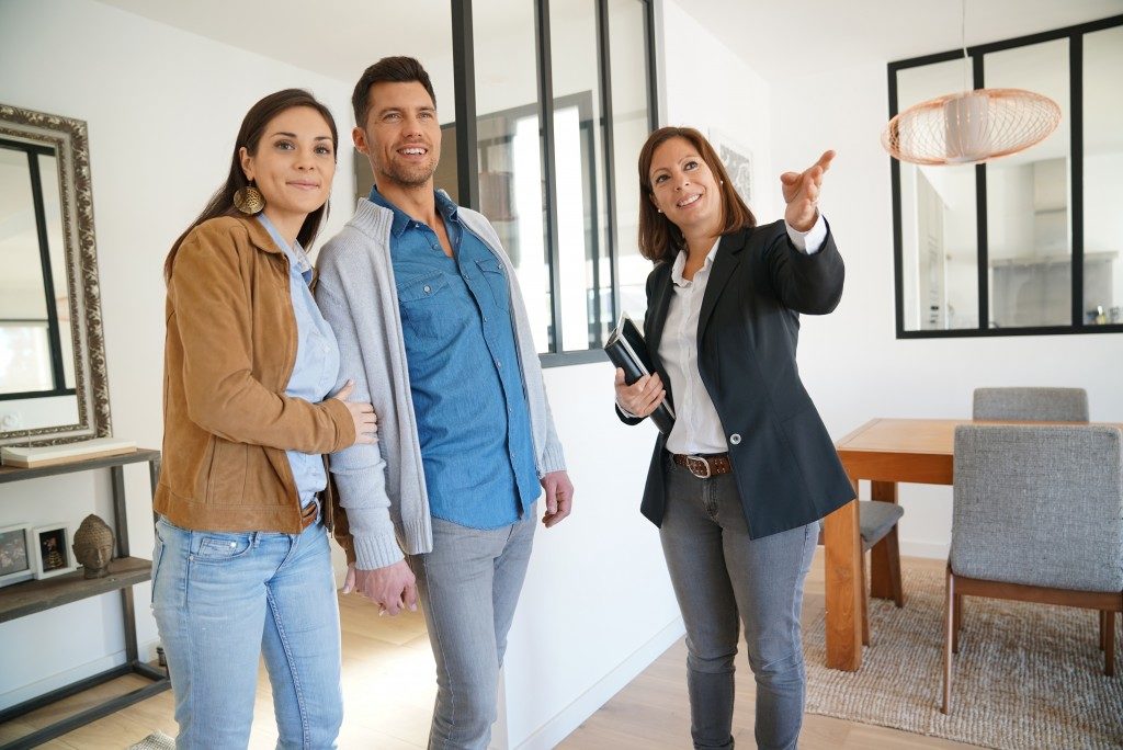real estate agent with clients