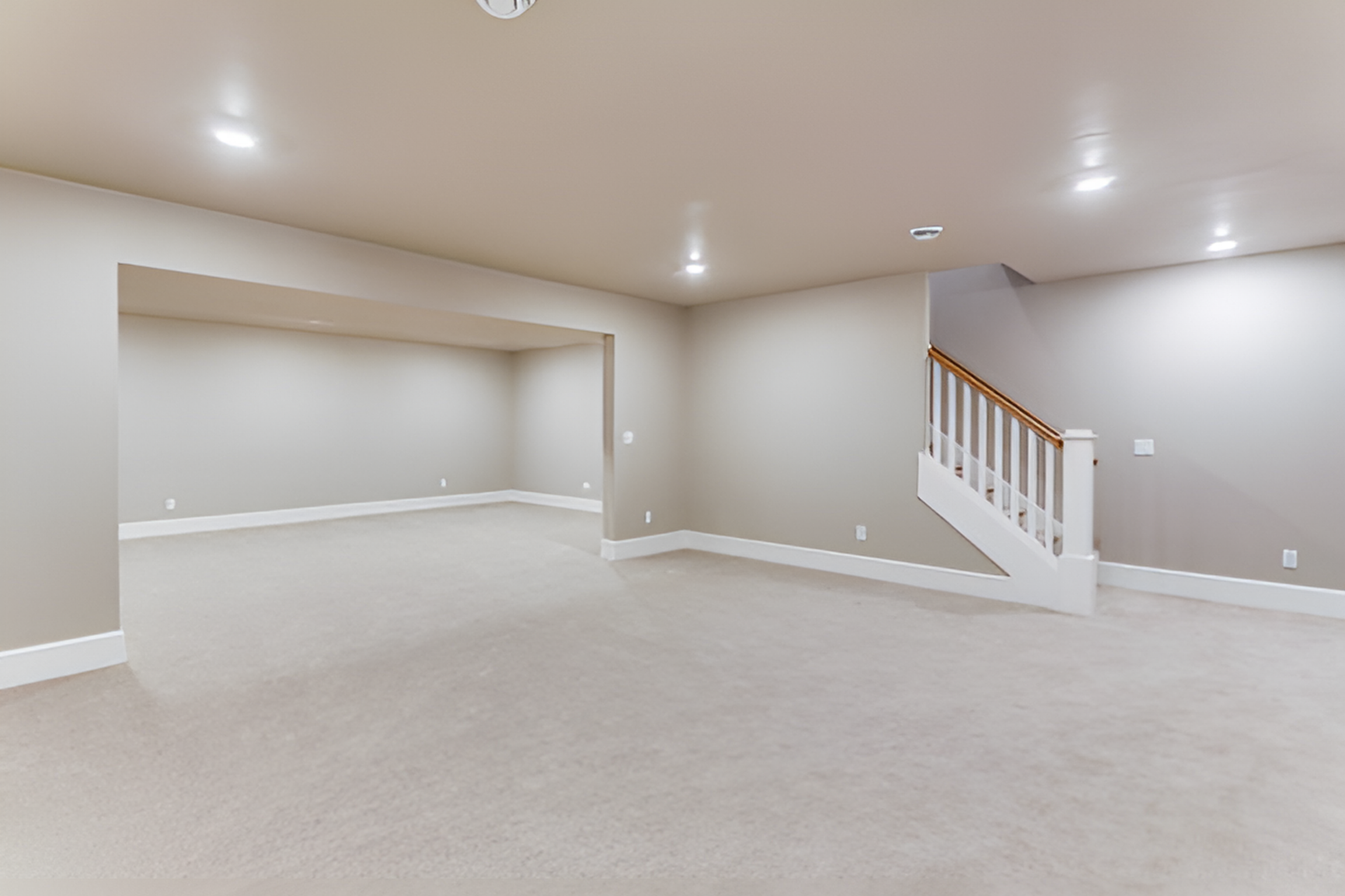 basement with off-white carpet flooring