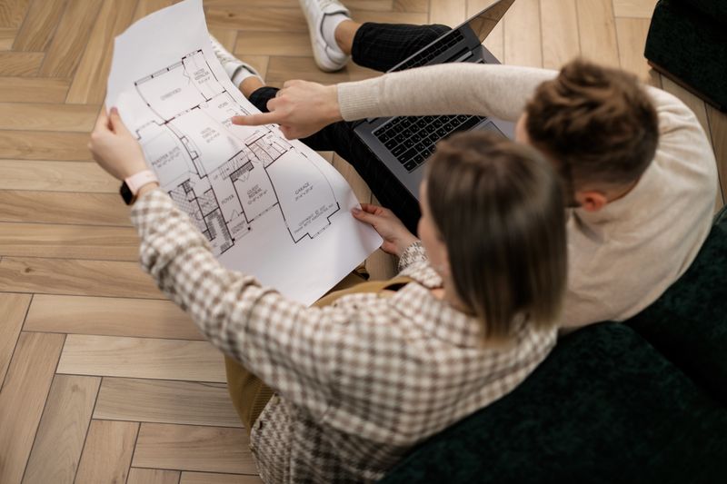 a couple looking at a home renovation plan